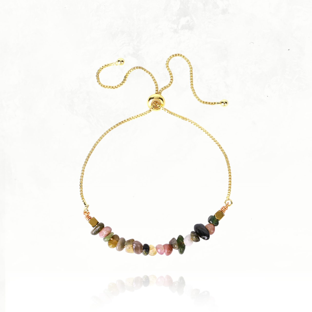Accessoire en cristaux naturels de tourmaline colorée, favorisant l’harmonie et l’énergie positive.