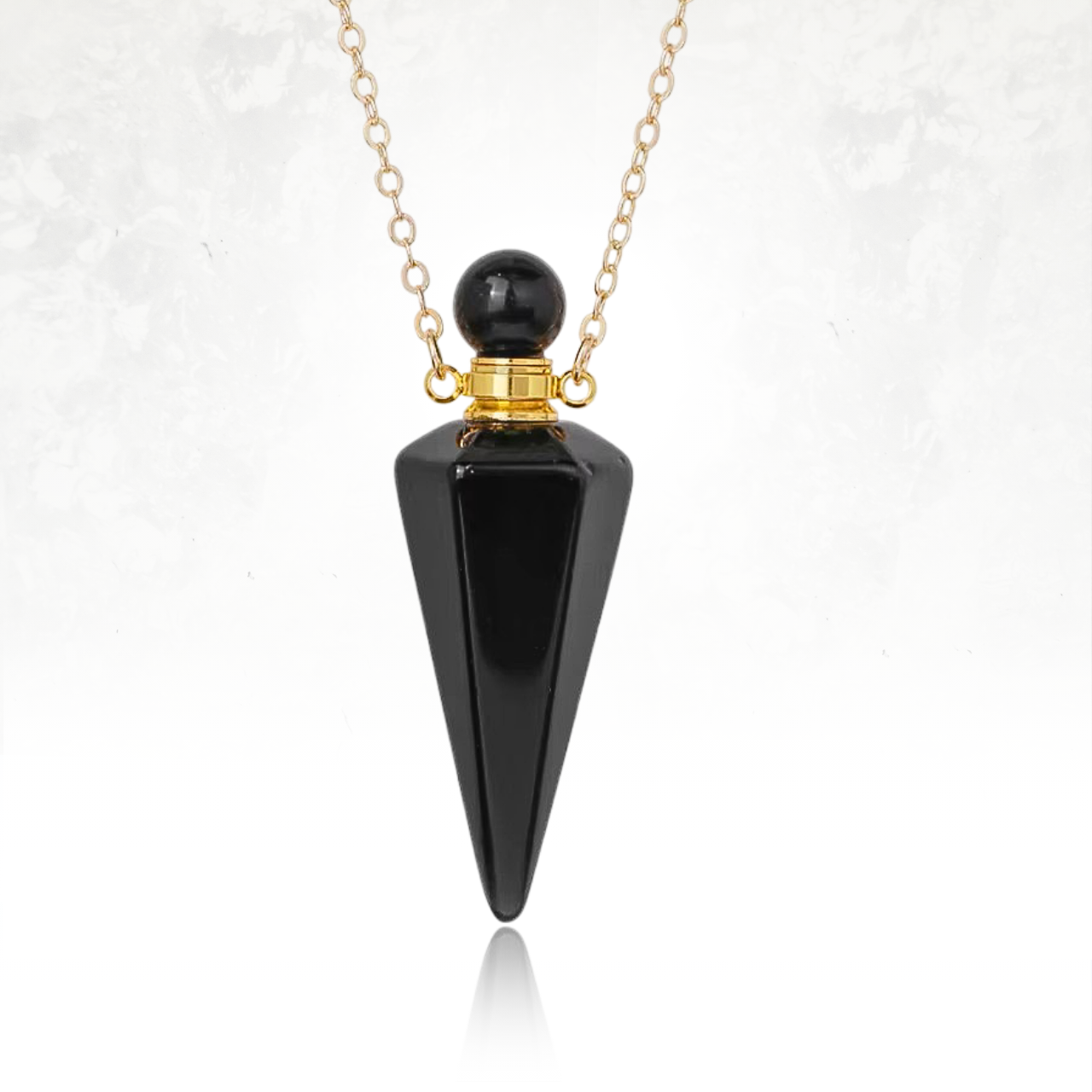 Pendentif ACITINE en pierre brute d'obsidienne pour aromathérapie nomade.