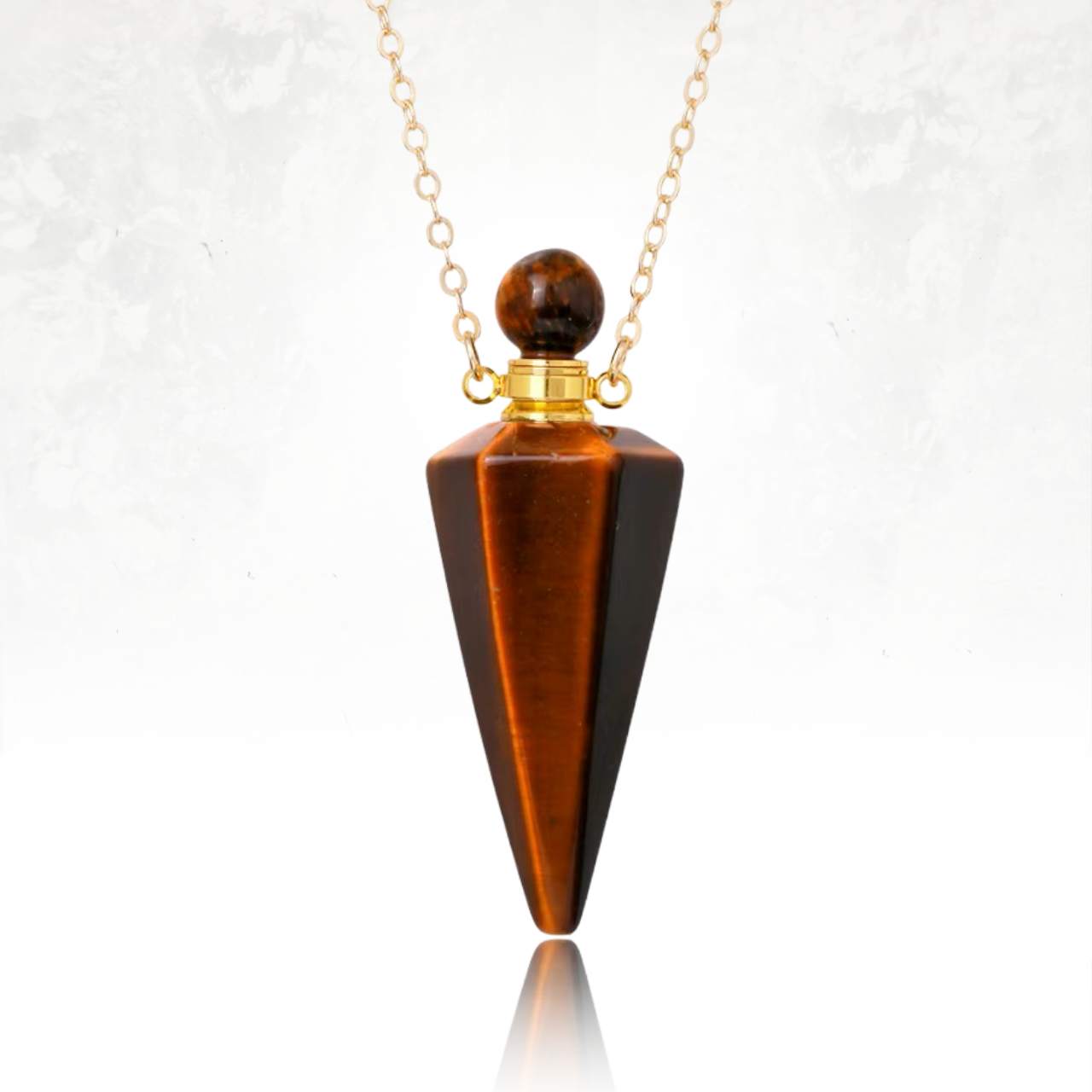 Collier bien-être avec fiole en pierre fine et bouchon vissé.