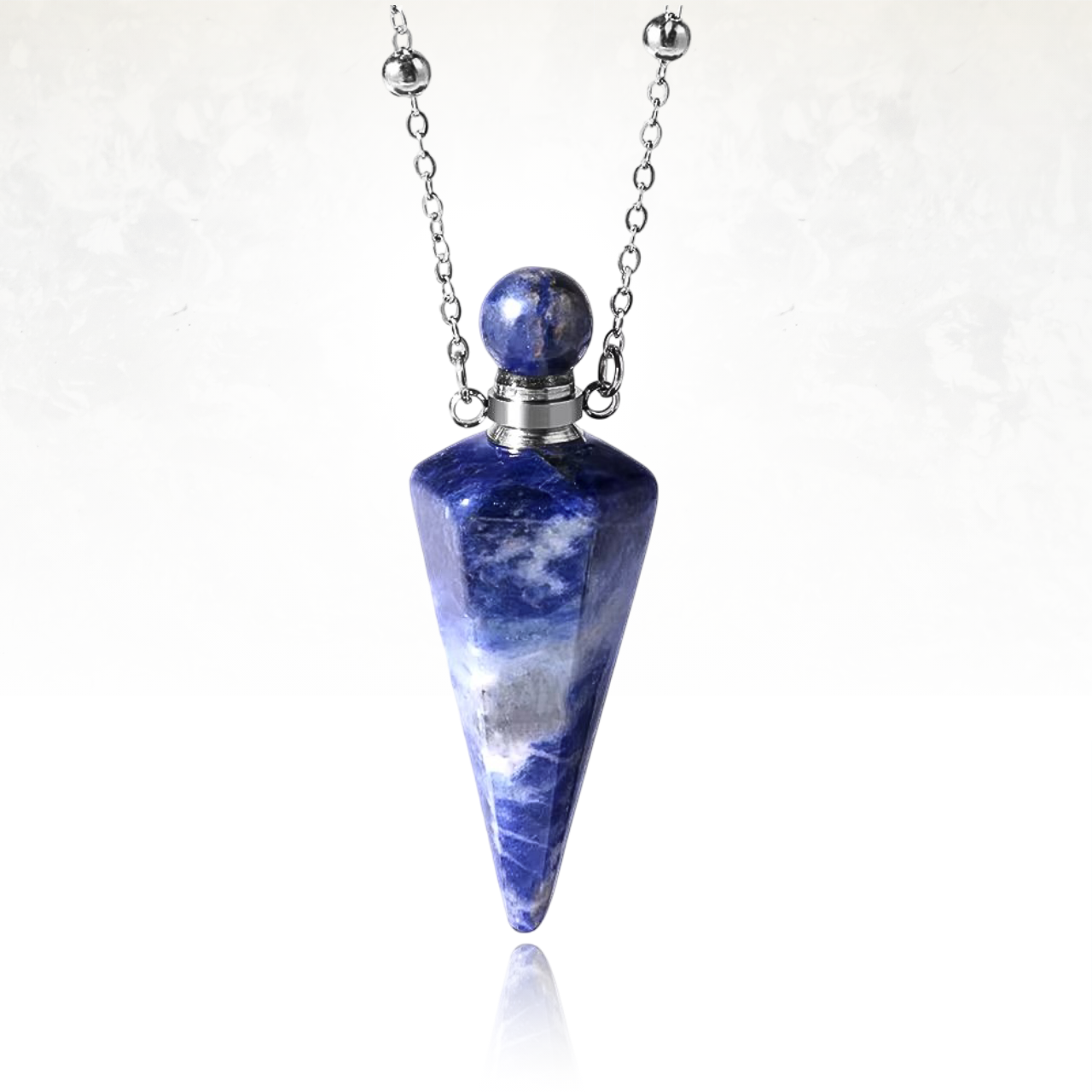 Pendentif artisanal en cristal poli de sodalite, fiole précieuse pour parfums.