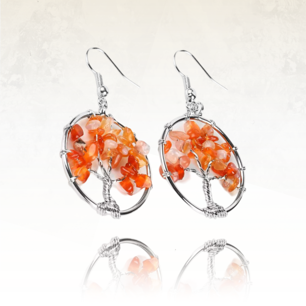 Boucles d'oreilles avec le sumbole d l'arbre de vie avec en agate rouge les feuilles de l'arbre