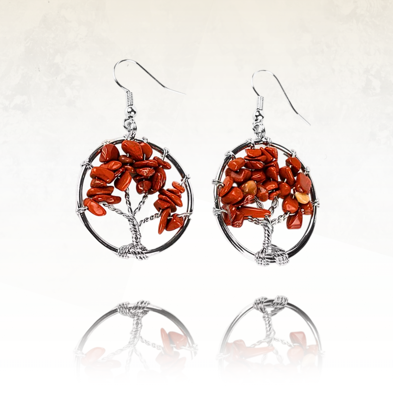 Boucles d'oreilles ANISI avec le symbole de l'arbre de vie soutenu par un cercle métallique