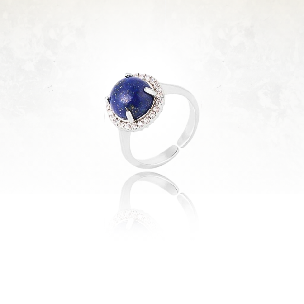 Bague CALIN ornĂ©e dâun lapis lazuli et dâun cercle de petits cristaux.