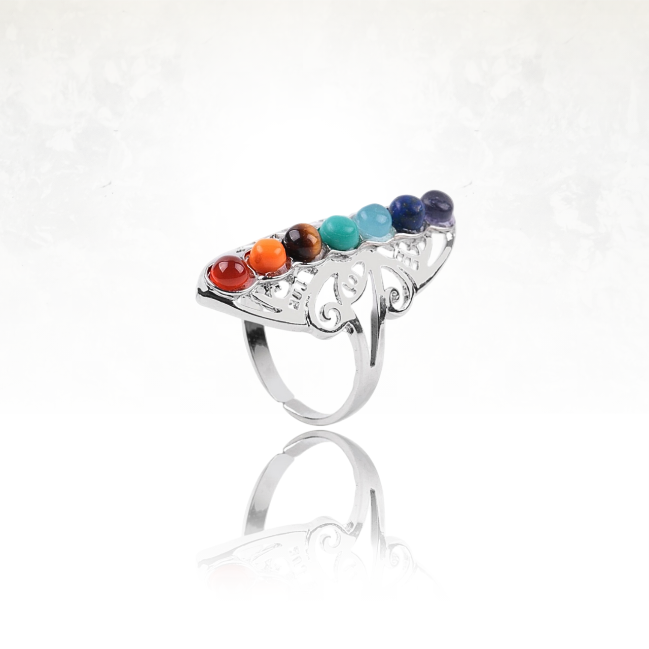 Bague en argent finement travaillée avec sept pierres sphériques aux couleurs des 7 chakras