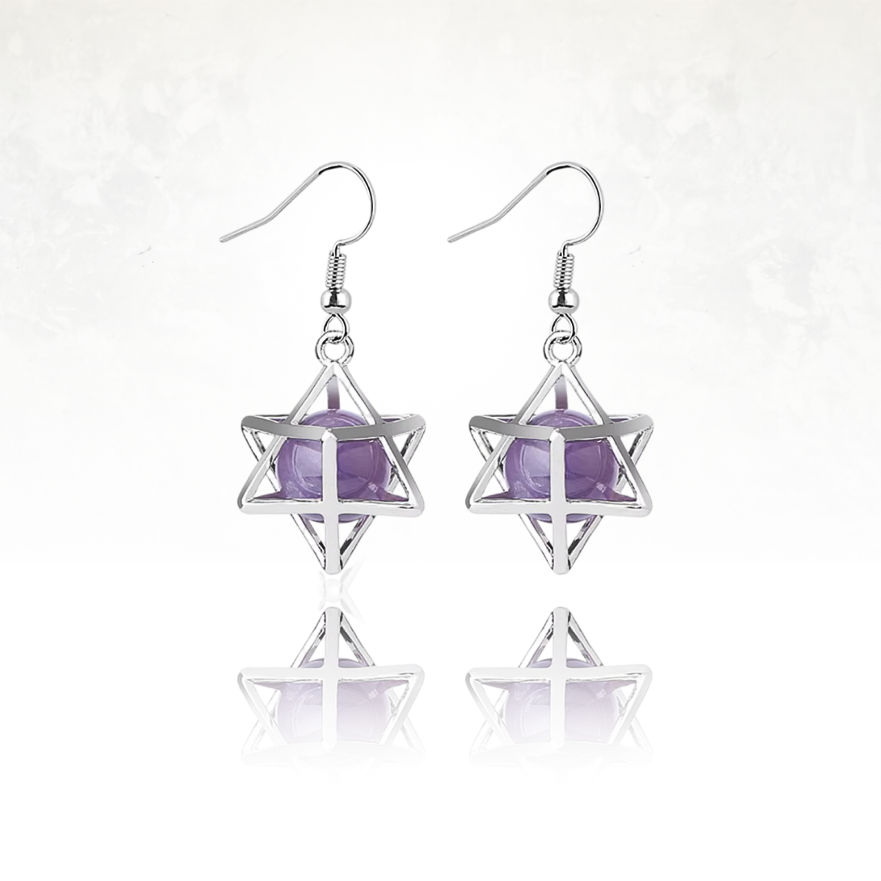Boucles d'oreilles Merkaba en métal argenté avec pierre naturelle violette.