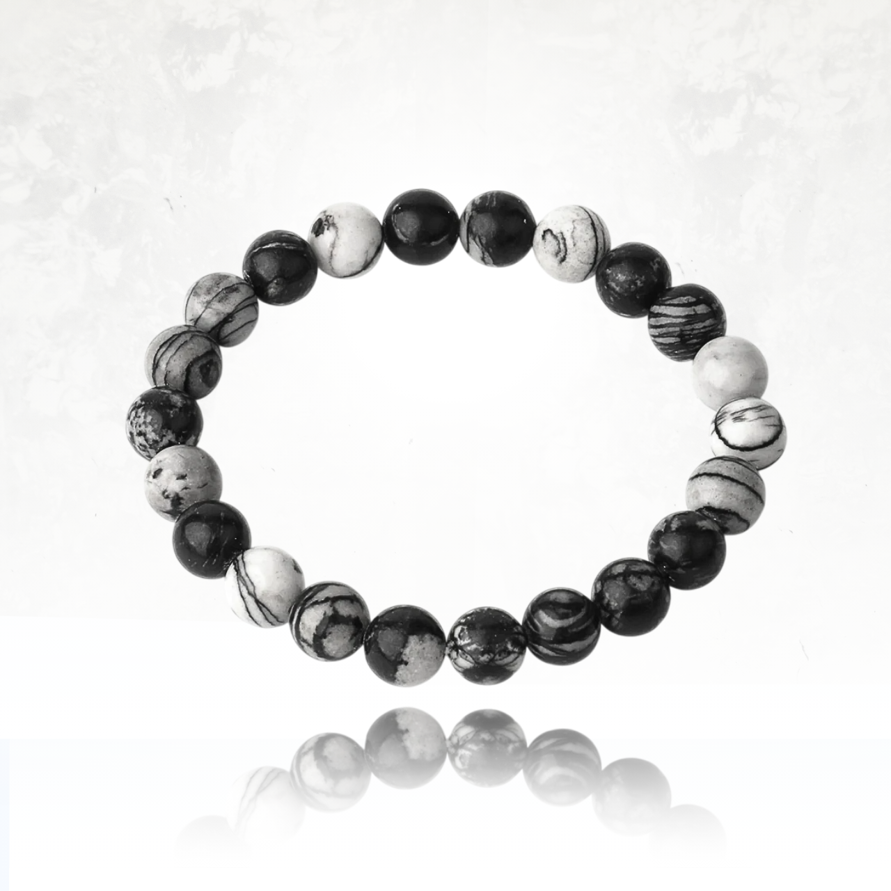 Poignet féminin portant le bracelet SALIMA en pierres naturelles de Jaspe Picasso