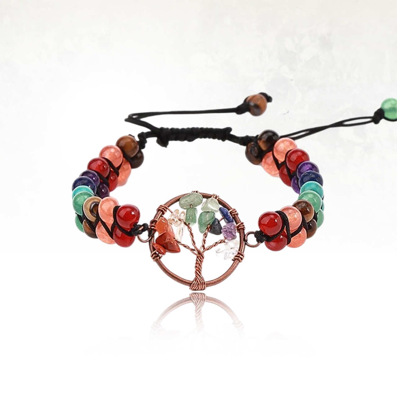 Bijou énergétique MONKA avec arbre de vie en fil cuivré et pierres semi-précieuses colorées.