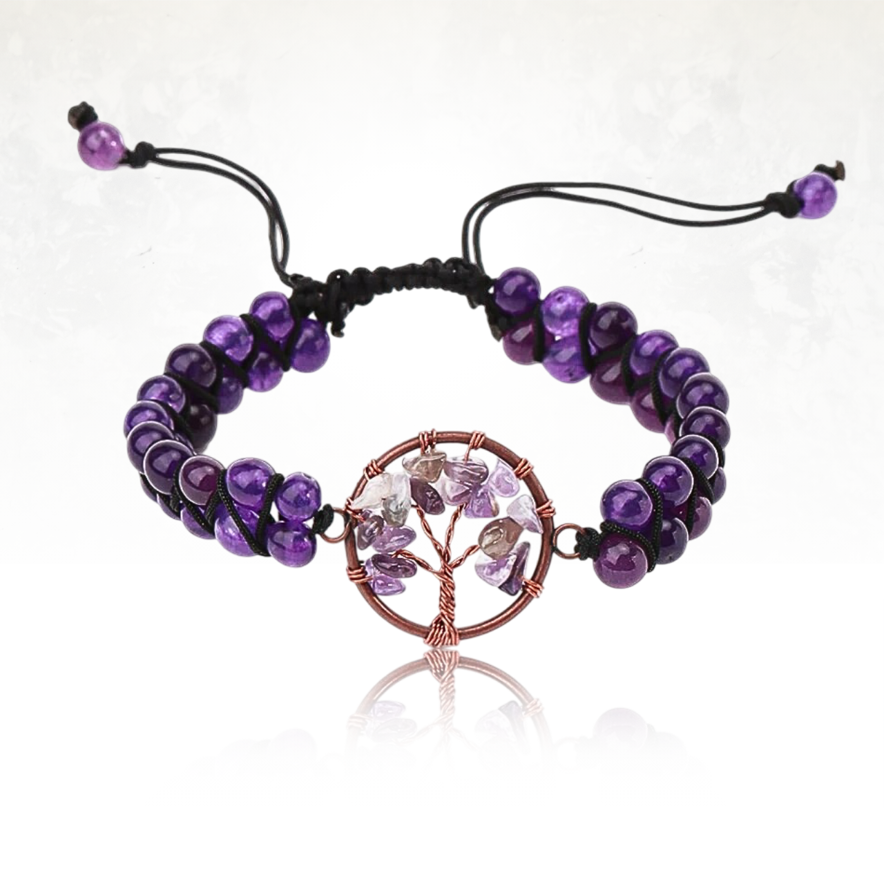 Bracelet chakra MONKA de couleur violette avec symbole sacrĂ© de lâarbre de vie.