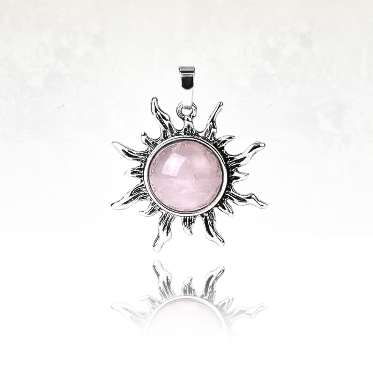 Collier doré avec pendentif soleil, symbole de force et de clarté spirituelle en quartz rose