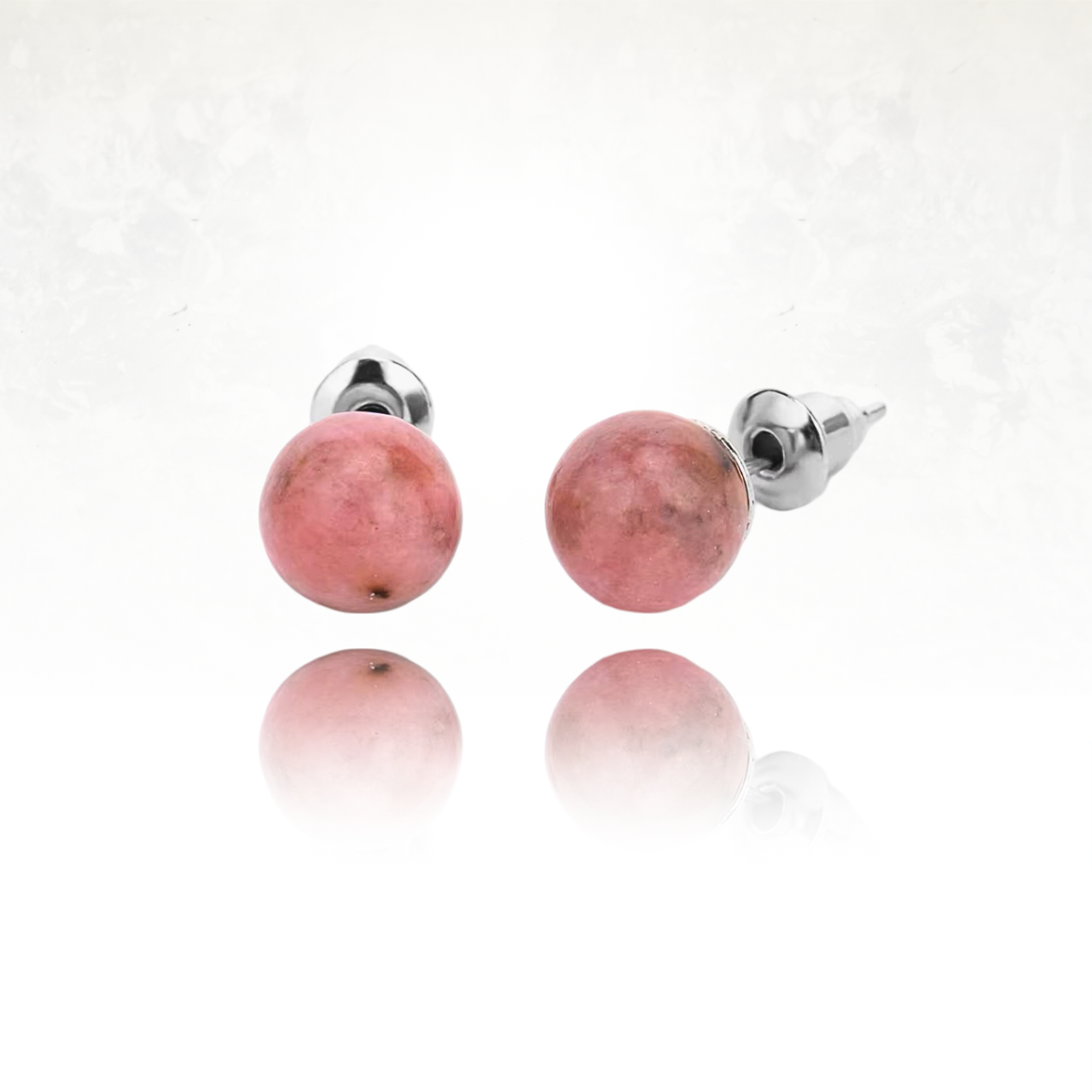 Clous d’oreilles en pierre semi-précieuse de rhodonite avec fermoir en métal argenté.
