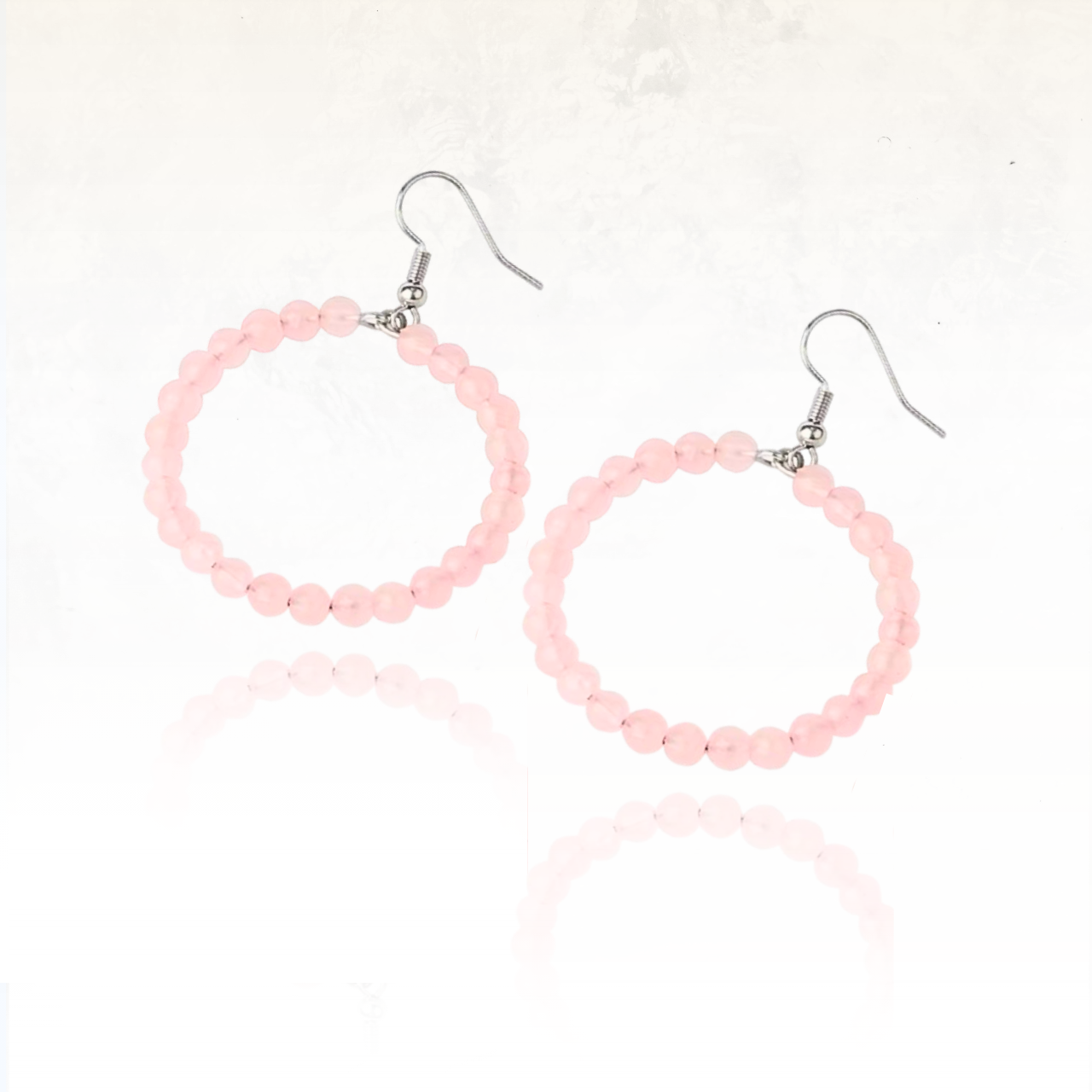 Boucles dâoreilles originales en quartz rose translucide