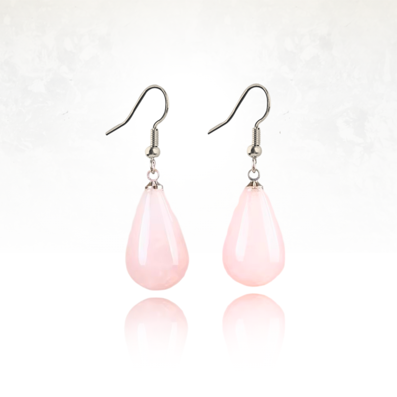 Boucles d'oreilles en quartz rose aux reflets roses envoûtants.