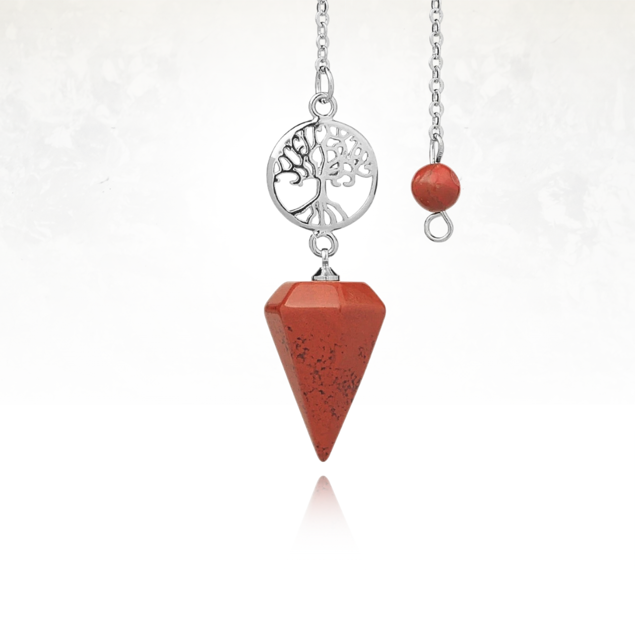 Accessoire de méditation et de divination en pierre et métal argenté.