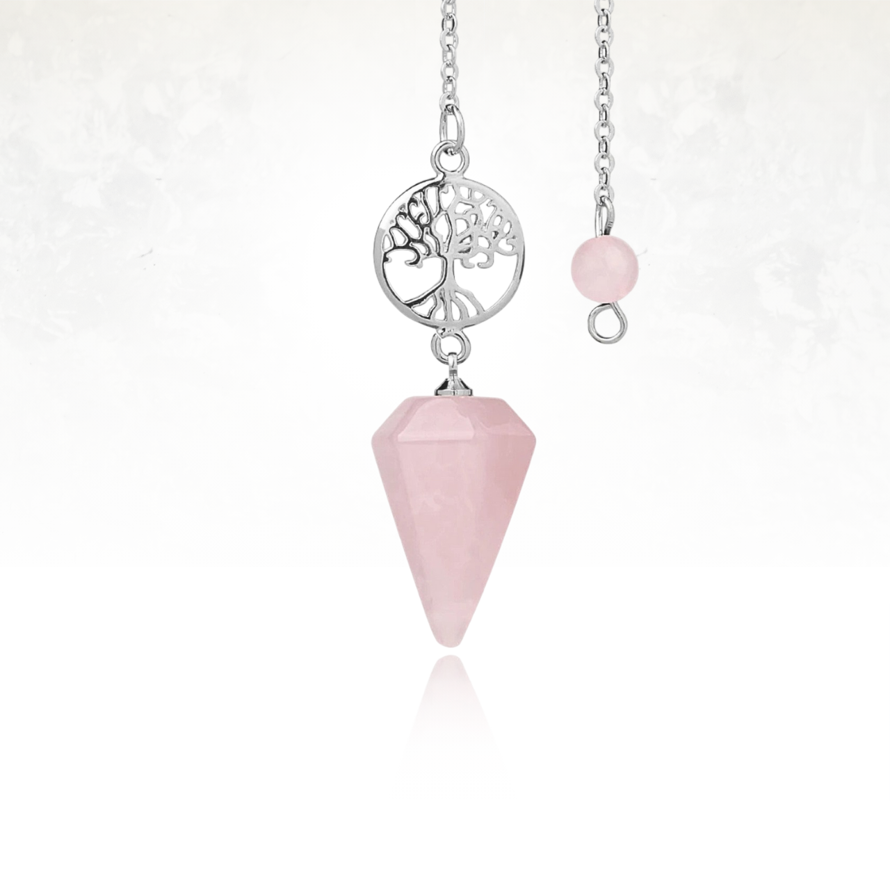 Pendule ésotérique en QUARTZ ROSE avec pendentif arbre de vie détaillé.

