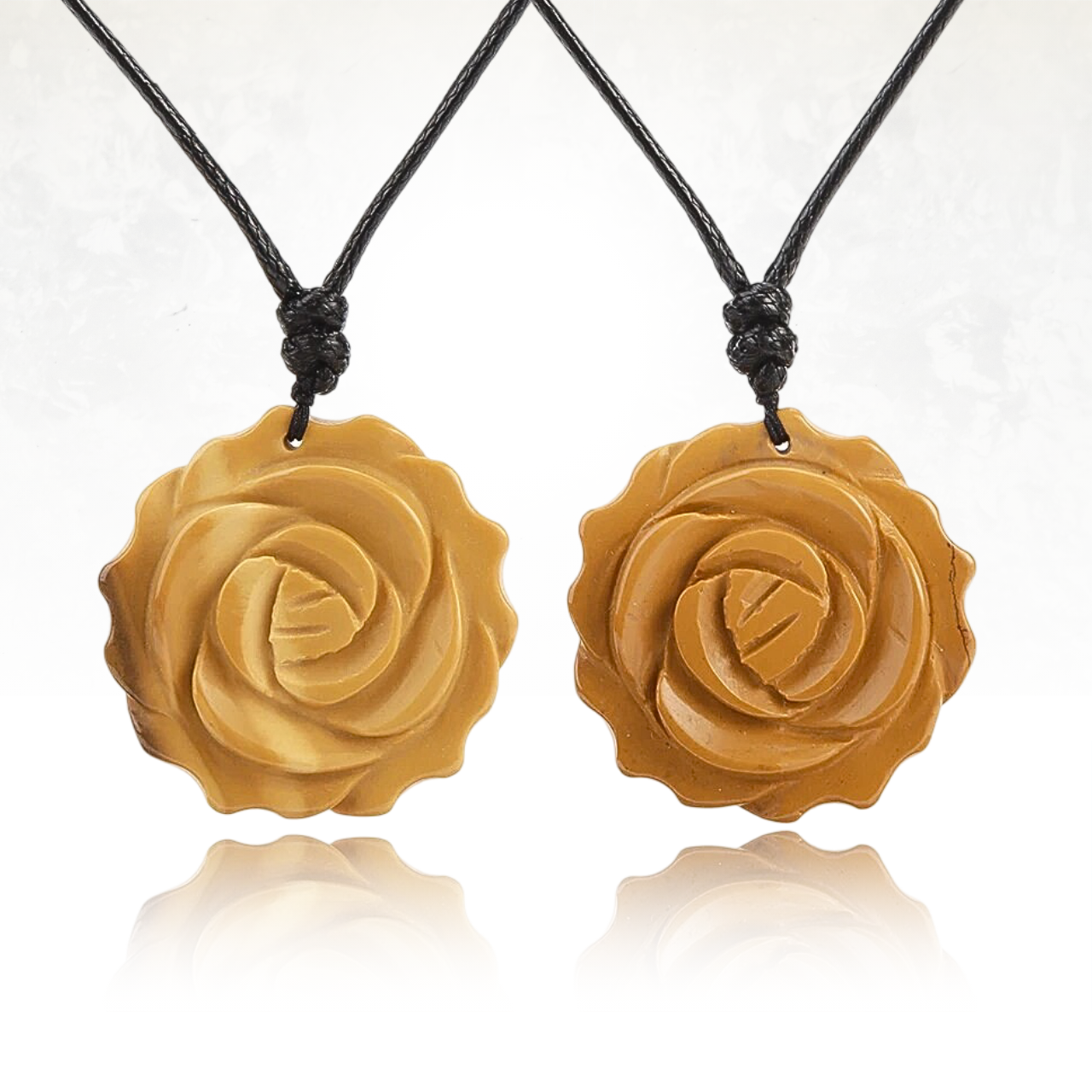 Pendentif rose en pierre naturelle 
 de mookaite suspendu à un cordon tressé.

