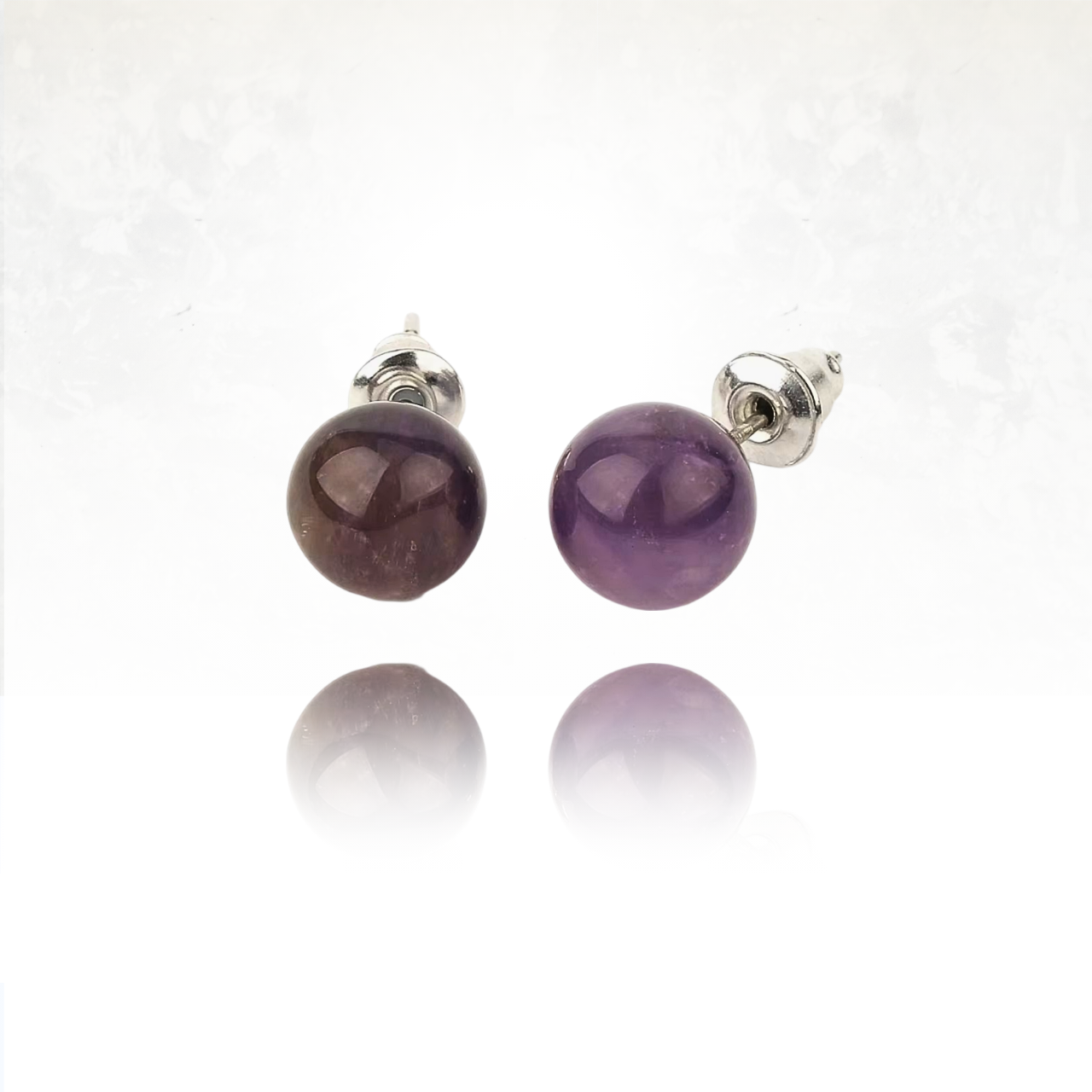 Élégantes boucles d'oreilles en pierre semi-précieuse montée sur métal argenté.