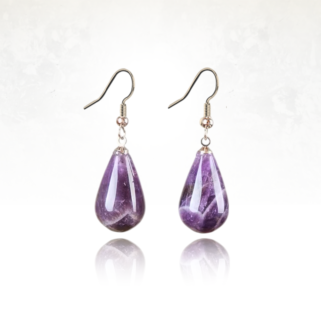 Boucles d'oreilles en pierre naturelle d'améthyste et en forme de goutte d'eau.